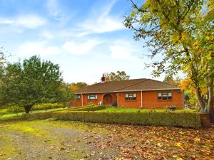 FRONT ASPECT FROM DRIVEWAY- click for photo gallery
